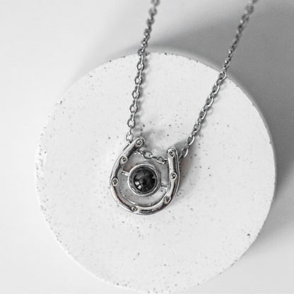 Horseshoe projection necklace