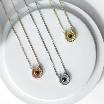 Horseshoe projection necklace